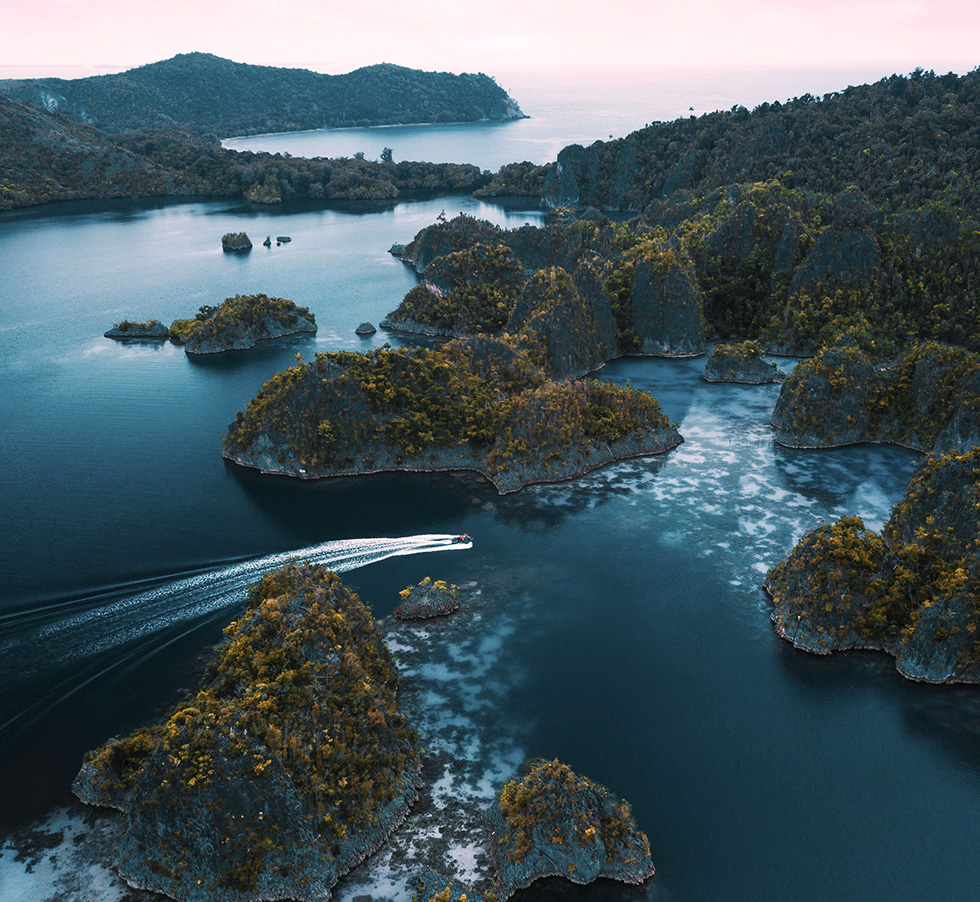 Aerial view of turquoise waters and limestone islands in Raja Ampat West Papua Indonesia